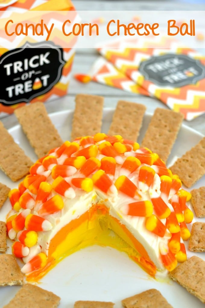Candy corn cheesecake cheese ball recipe that features white, orange, and yellow layers just like the candy. This is a great fall dessert for Halloween.