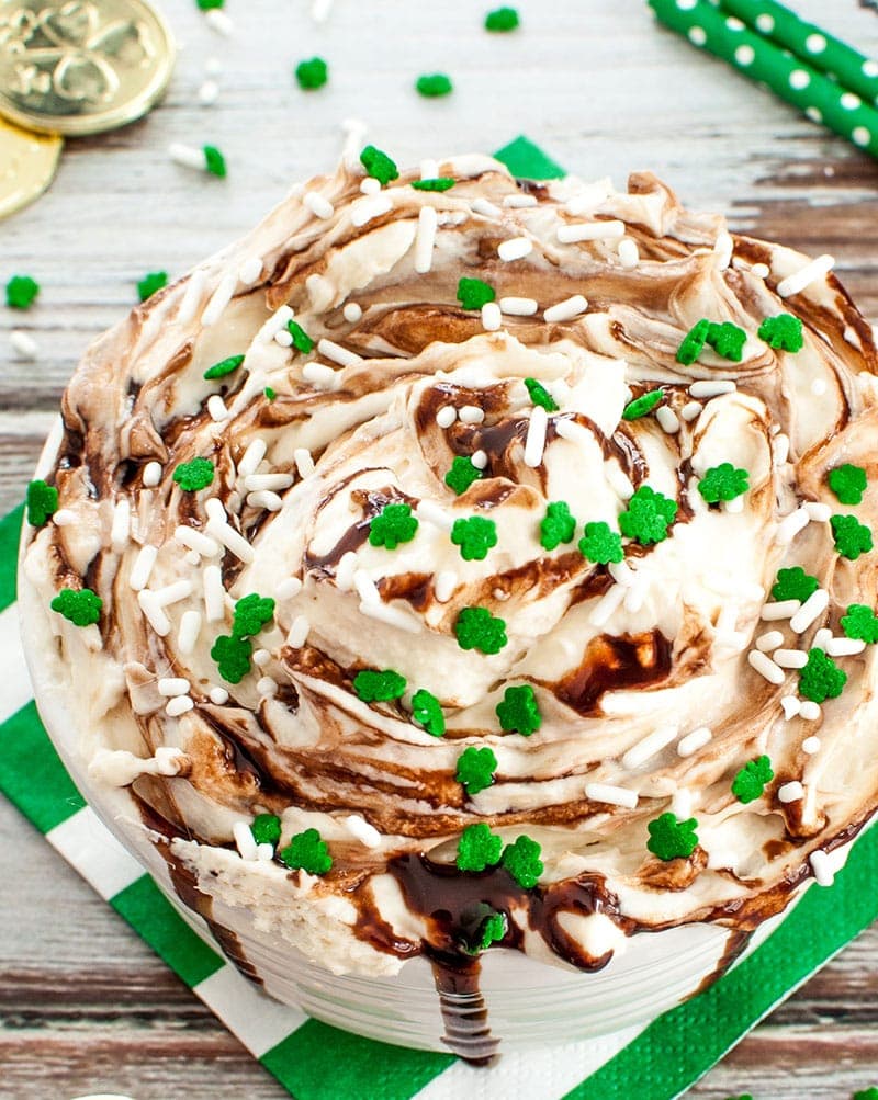 Bowl of Baileys Irish Cream Dip topped with clover leaf sprinkles