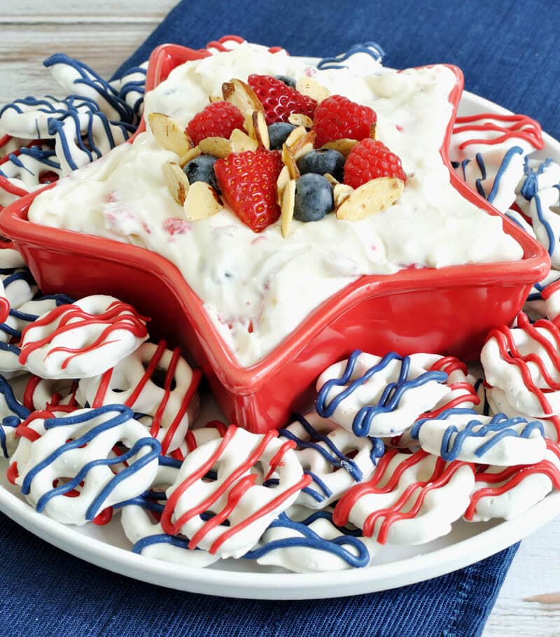 Almond Berry Fruit Dip- a festive dessert for the 4th of July. Dip combines the flavor of almond with berries and cream cheese for a patriotic and easy recipe. 