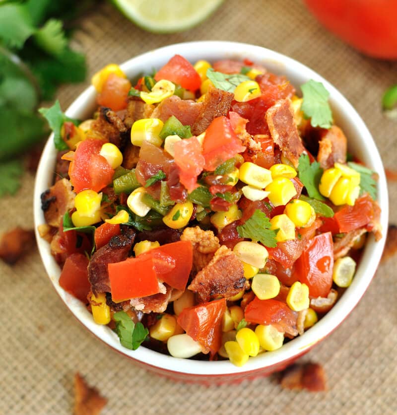 Fresh summer salsa gets a kick with the addition of chipotle peppers and a nice crunch from crumbled bacon in this chipotle bacon and corn salsa recipe.