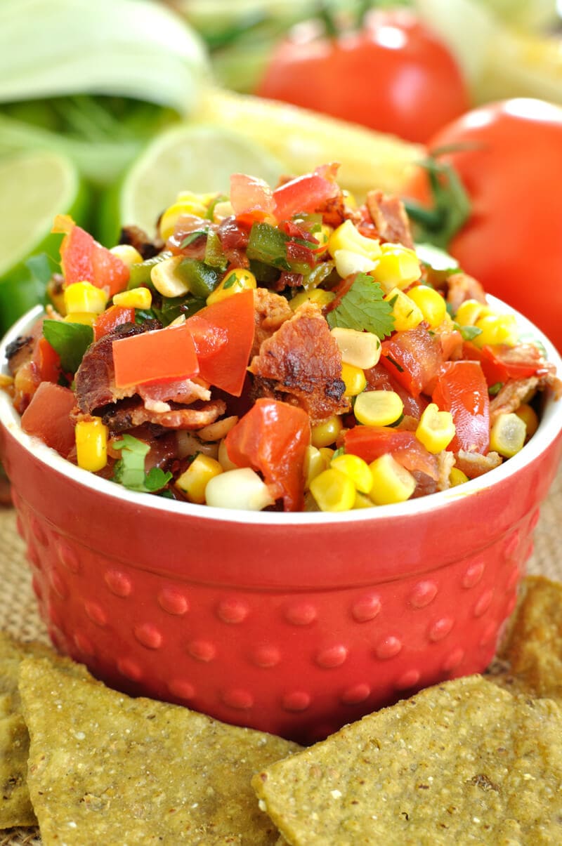 Fresh summer salsa gets a kick with the addition of chipotle peppers and a nice crunch from crumbled bacon in this chipotle bacon and corn salsa recipe.