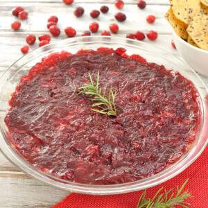 Festive dip recipe with cranberry sauce and rosemary. Warm cranberry and rosemary cream cheese dip is a great appetizer for a holiday party or Christmas.