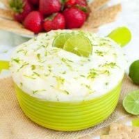 green bowl of key lime pie dip garnished with lime zest