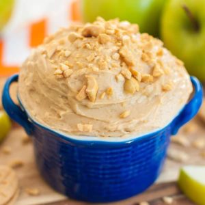 Green apples and blue bowl of peanut butter apple dip