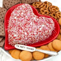 heart dessert peanut butter cheese ball on a red heart shaped platter