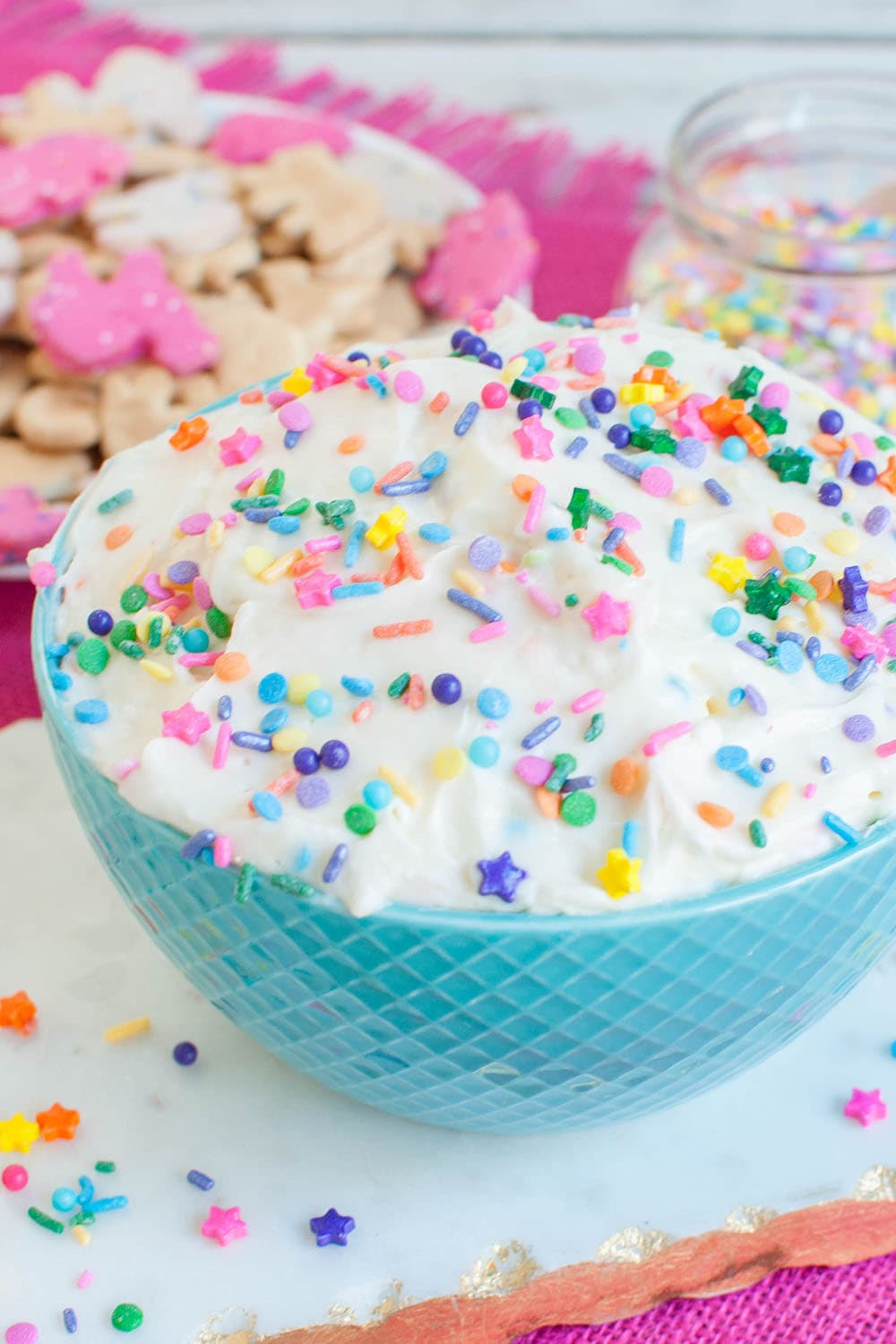 vanilla dip in a blue bowl topped with sprinkles