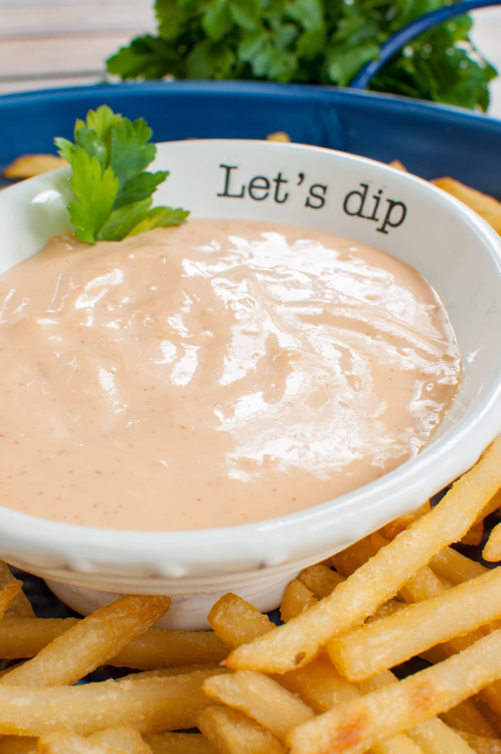 pink dip in a white bowl that says "let's dip" with fries on the side